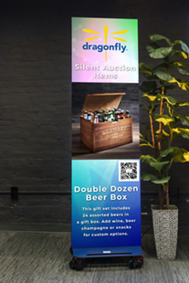 Tall wheeled display with Dragonfly logo and